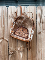 Tooled Sunflower Pocket Hair On Hide Backpack